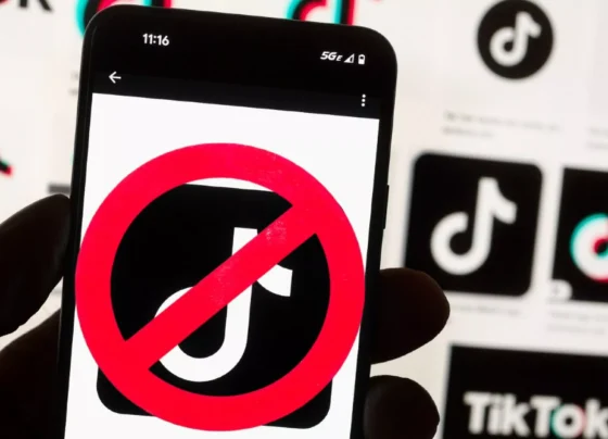 A smartphone screen displaying the TikTok logo with a red cancel sign across it, symbolizing restriction or ban.
