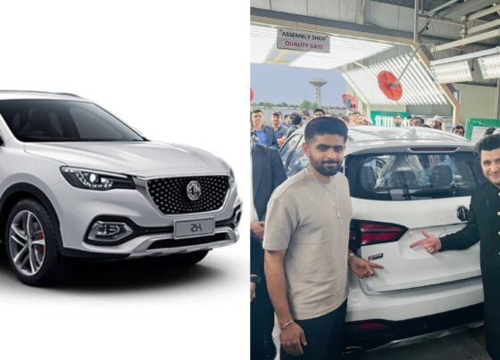 Javed Afridi handing over the keys to a new car to Babar Azam in a ceremonial gesture, with both individuals smiling and standing beside the vehicle.