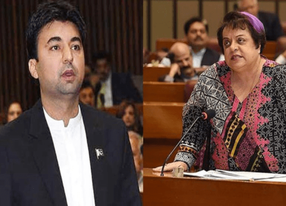 Murad Saeed and Shireen Mizari engaged in a discussion at a political event.