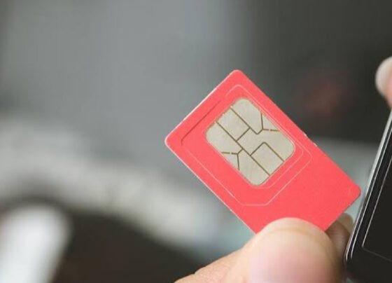 Close-up image of a red SIM card