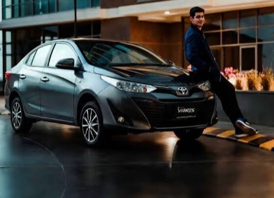Man standing next to the new Toyota Yaris