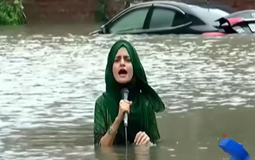 Female reporter goes viral for reporting in knee-deep rainwater in Lahore