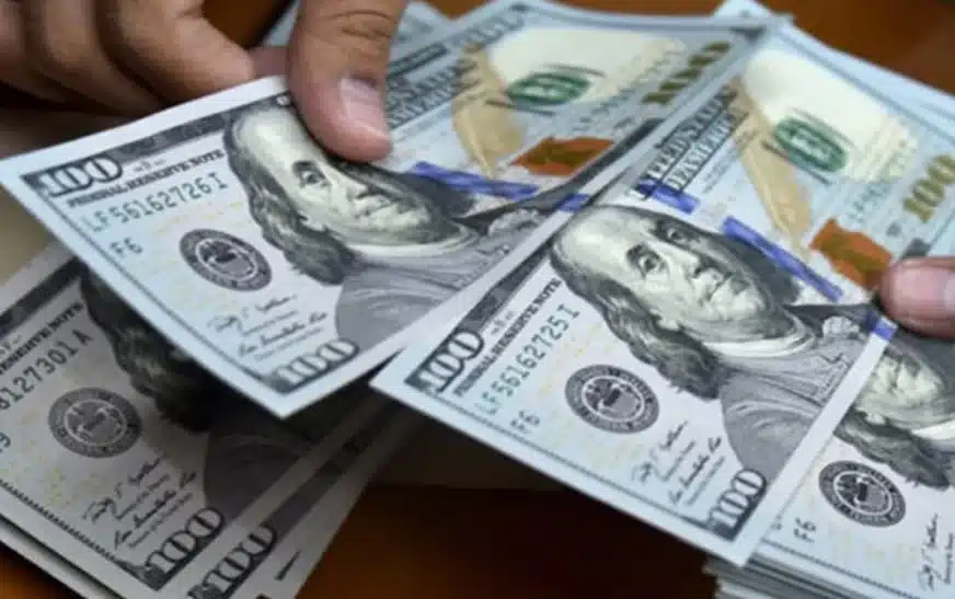 Dollar surges in interbank market, drops in open market